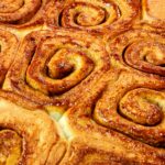 Freshly baked cinnamon rolls with warm, sweet aroma perfect for breakfast or dessert.